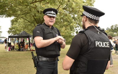 Chief Constable talking with an officer at Reading festival